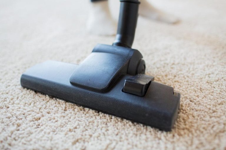 a picture of a carpet being cleaned by a vacuum cleaner