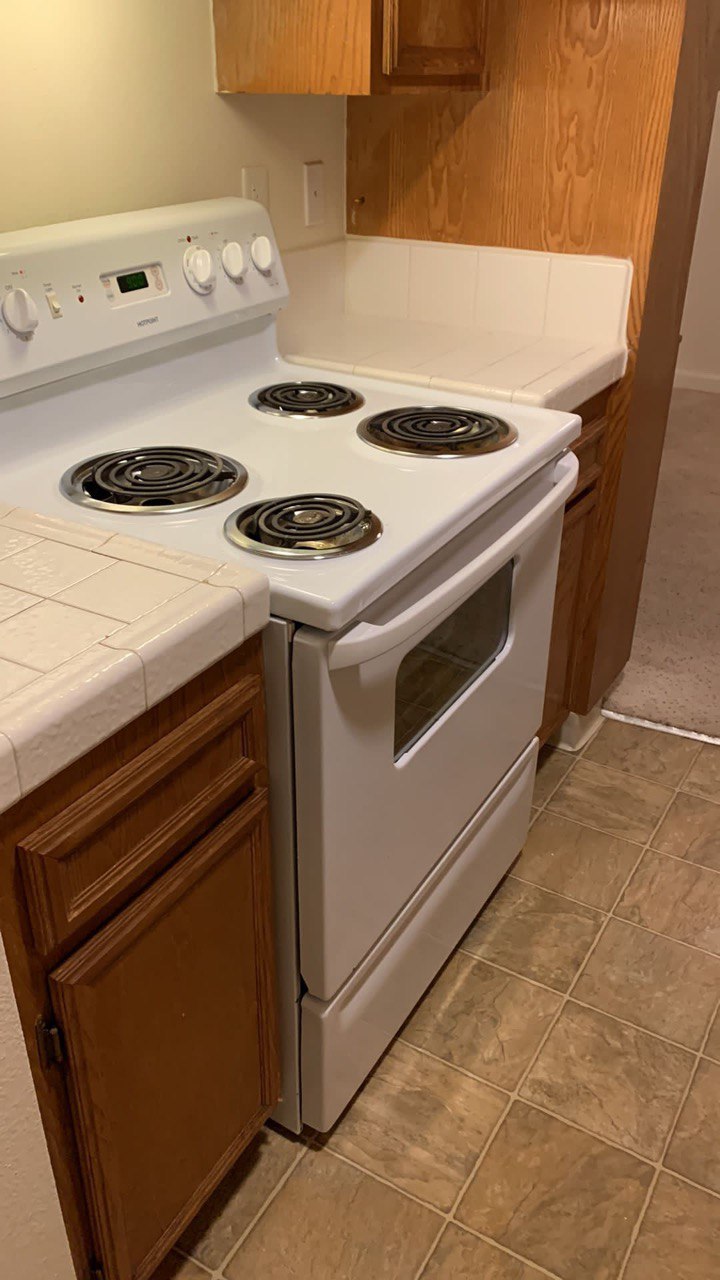 Clean kitchen stove and counters after a San Diego move-out clean